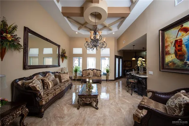 a dining room with furniture and a chandelier