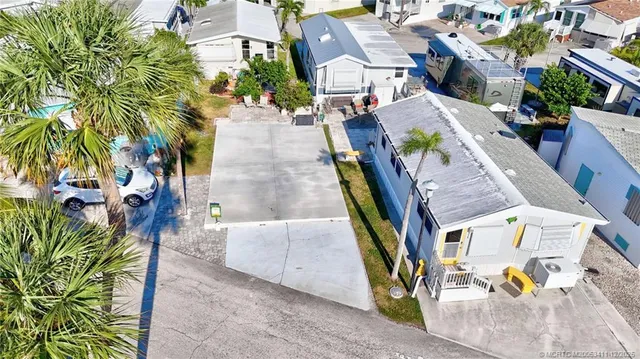 an aerial view of multiple houses with outdoor space