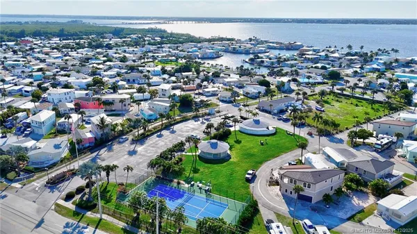 an aerial view of residential houses with outdoor space