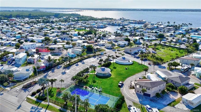 an aerial view of residential houses with outdoor space