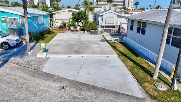 a view of multiple houses with yard