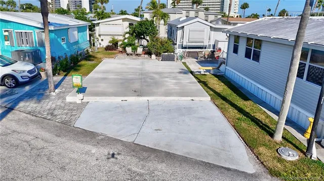 a view of multiple houses with yard