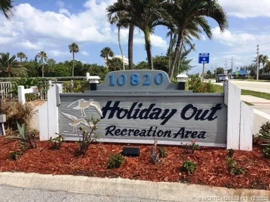 an aerial view of a swimming pool patio and outdoor seating