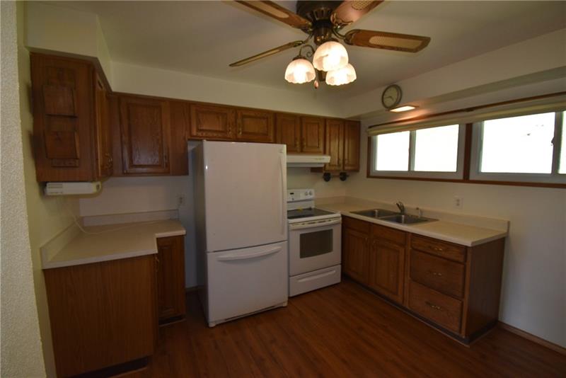 170 Franklin Farms Road Washington, PA 15301 - Photo 10 of 25 Eat-in kitchen features new electric range, refrigerator and laminate flooring.