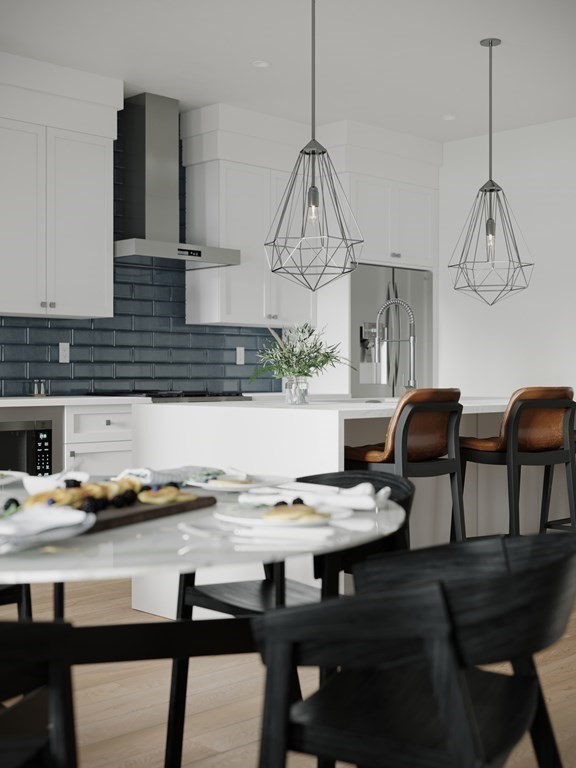 4 Anawan Avenue, Unit 4 Boston, MA 02132 - Photo 3 of 6 a kitchen with a table chairs and a stove