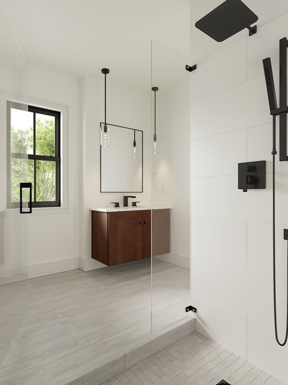 4 Anawan Avenue, Unit 4 Boston, MA 02132 - Photo 5 of 6 a bathroom with a tub sink and mirror