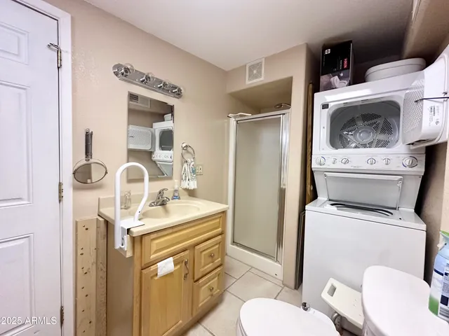 a living room with furniture fireplace and a large window