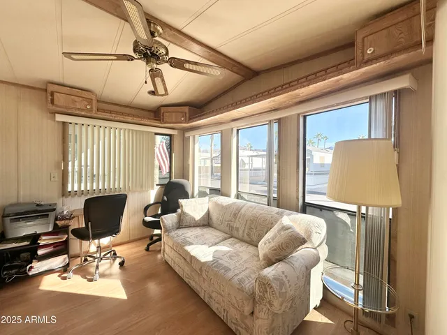 a living room with furniture and a large window