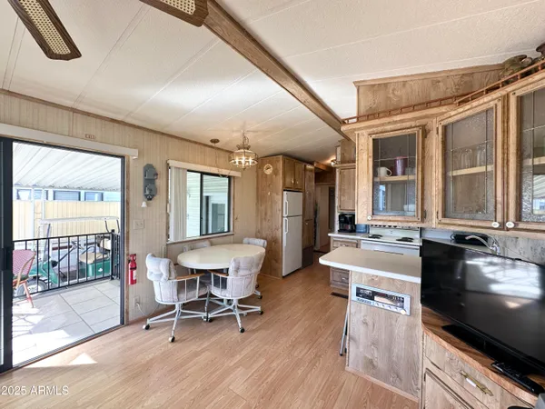 a kitchen with a stove a refrigerator and a fireplace