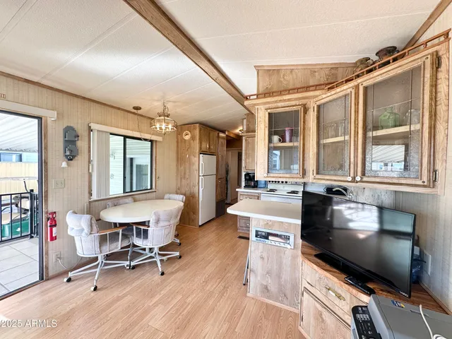 a kitchen with stainless steel appliances a stove a sink and a refrigerator