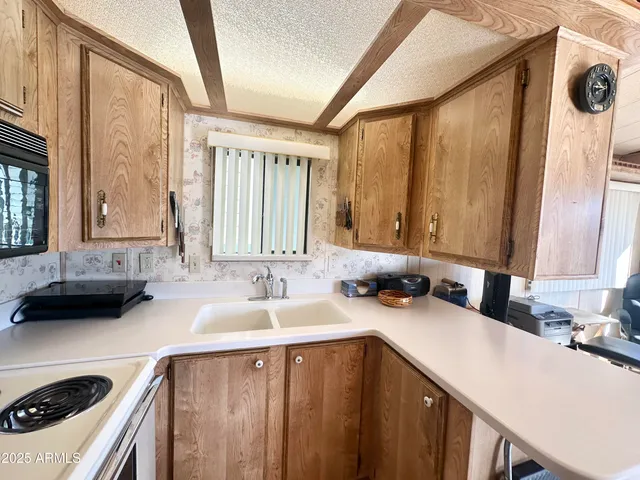 a kitchen with a stove and a sink