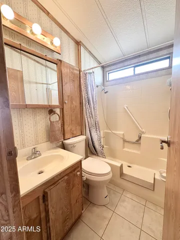 a very nice looking room with a large window and dining space