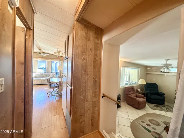 a bedroom with a bed and a tv on the dresser