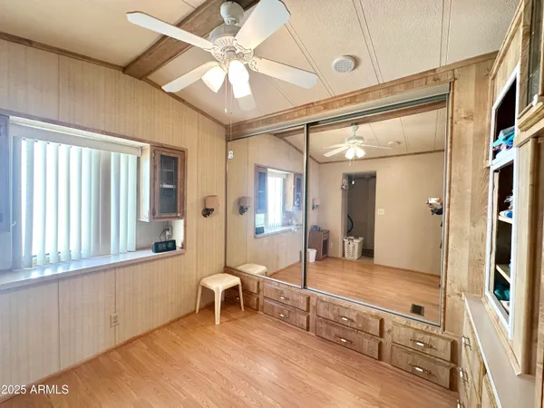 a room with cabinets and wooden floor