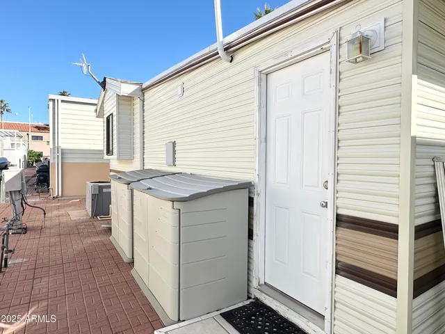 a view of a swimming pool with outdoor seating