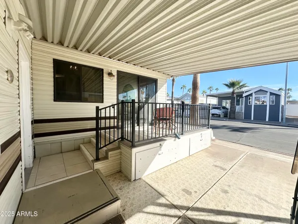 a view of a porch with furniture