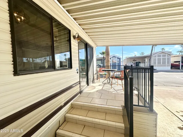 a view of a building with sitting area