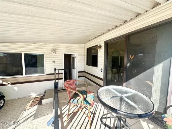 a lobby with furniture and floor to ceiling window