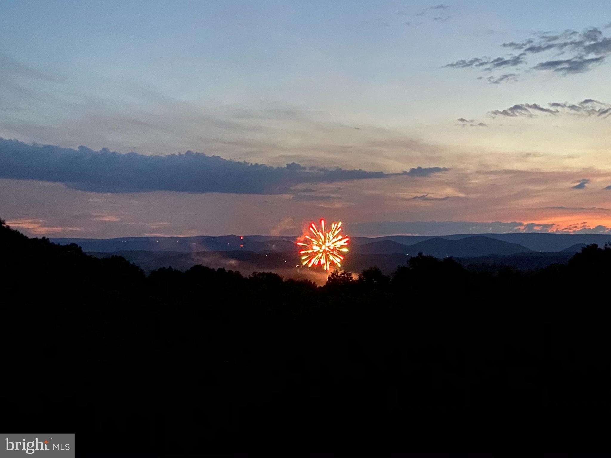 879 Olde Oak View Drive Springfield, WV 26763 - Photo 49 of 70 a sunset view with a lake