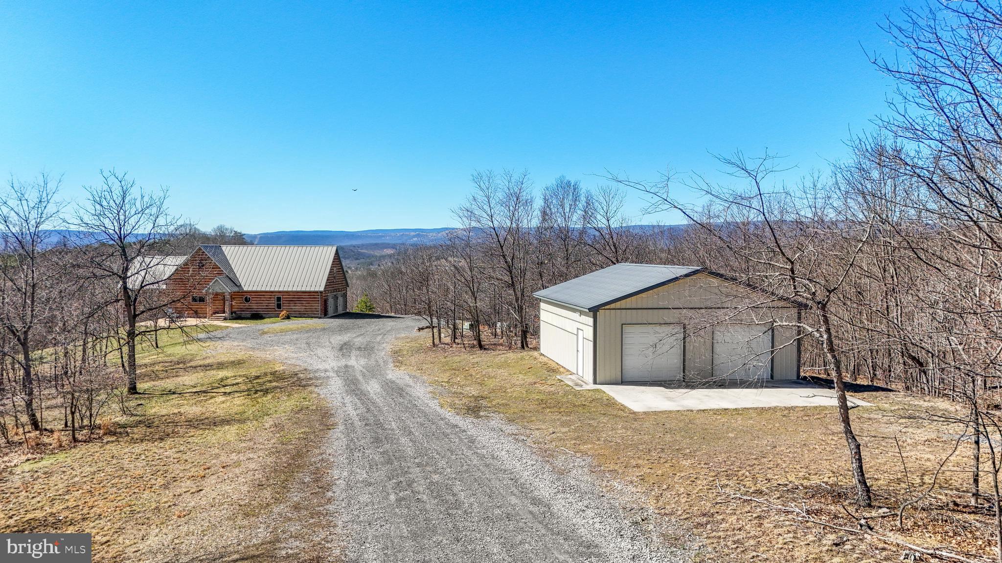 879 Olde Oak View Drive Springfield, WV 26763 - Photo 56 of 70 a house with trees in front of it