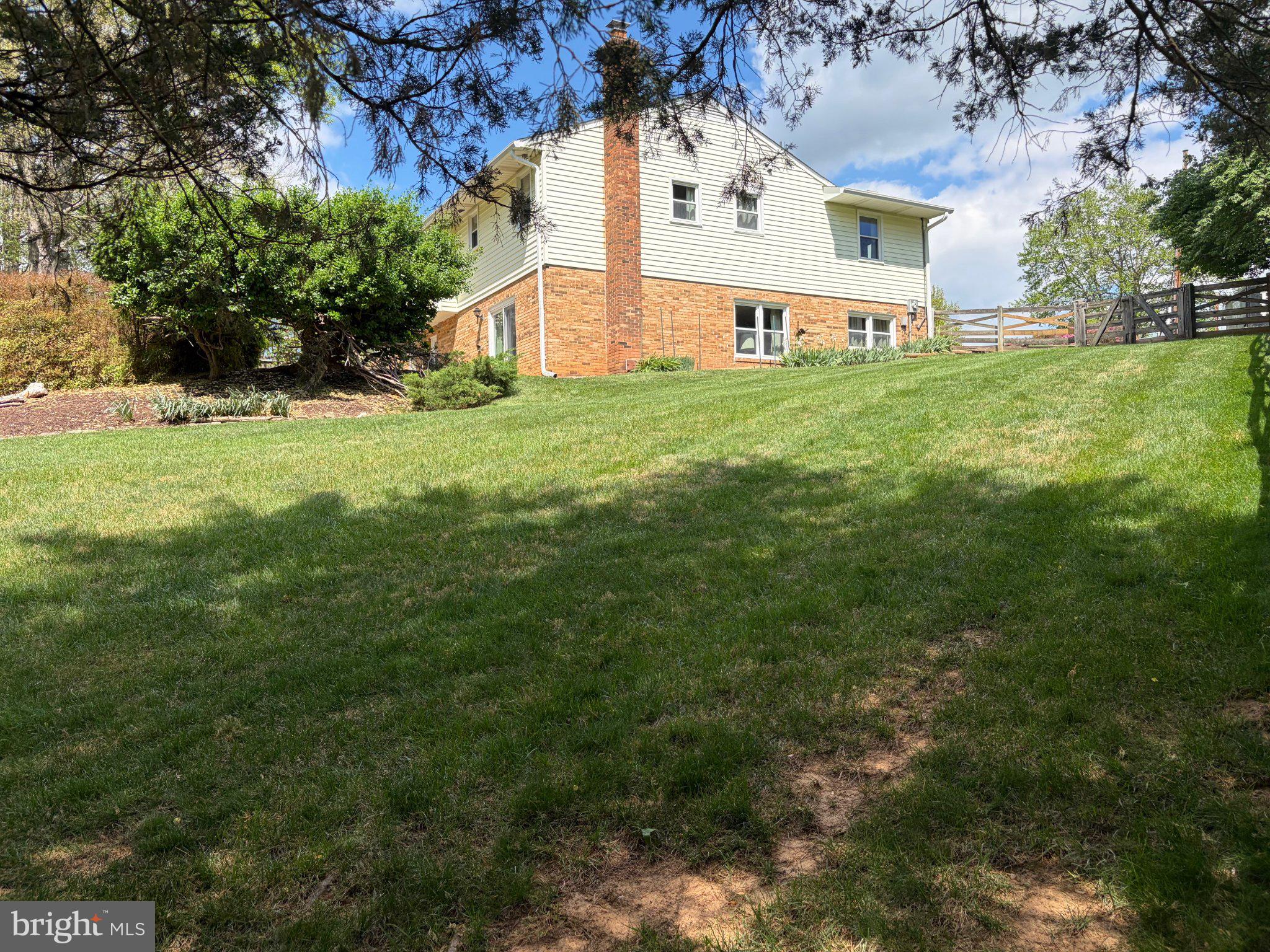 10425 Lake Ridge Drive Oakton, VA 22124 - Photo 2 of 5 a view of white house with a yard