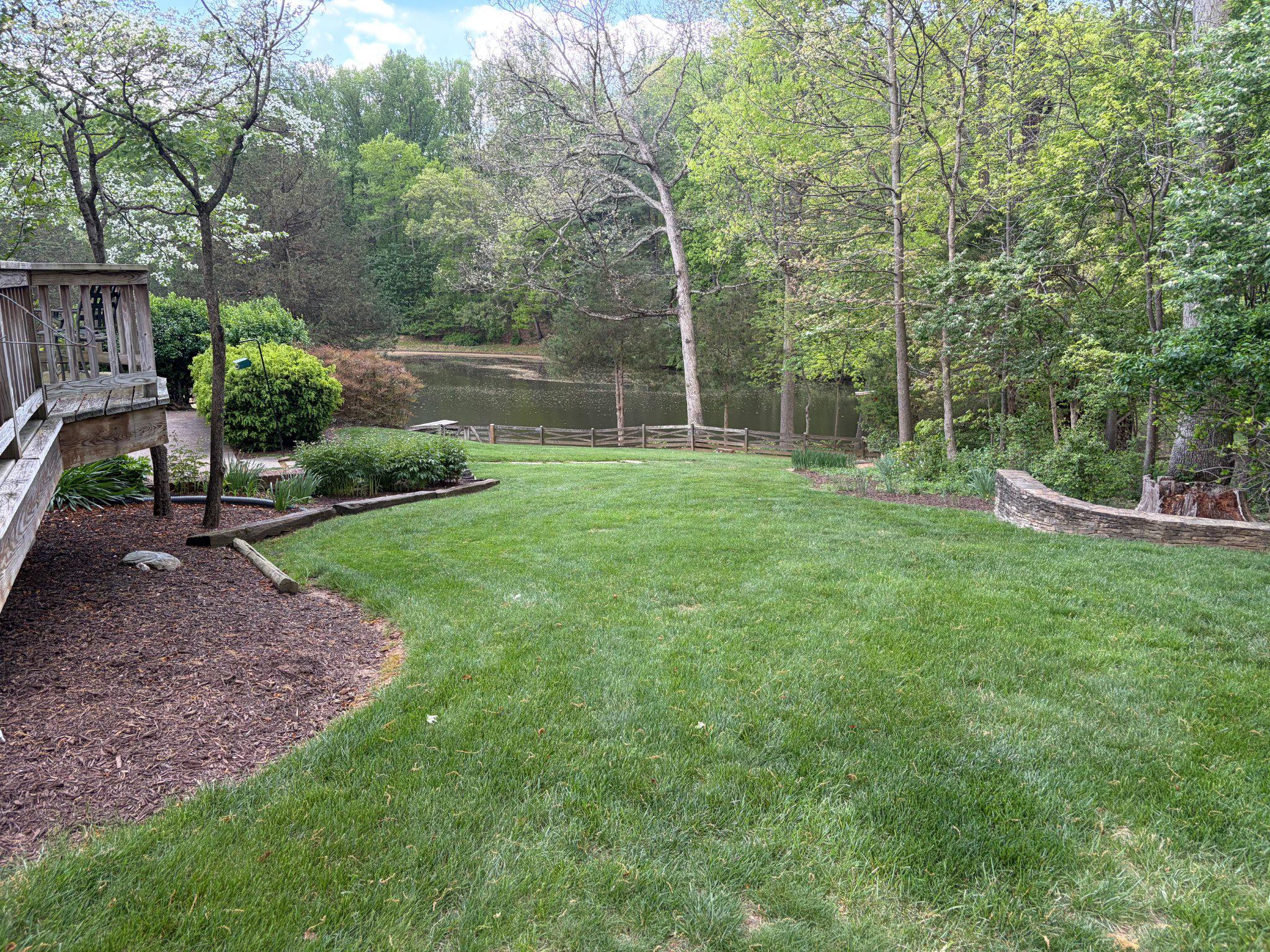 10425 Lake Ridge Drive Oakton, VA 22124 - Photo 4 of 5 a view of a backyard with a garden and trees