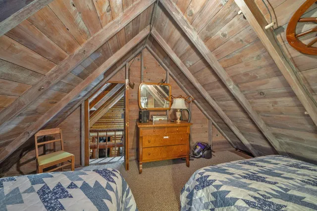 a view of a house with backyard and wooden floor