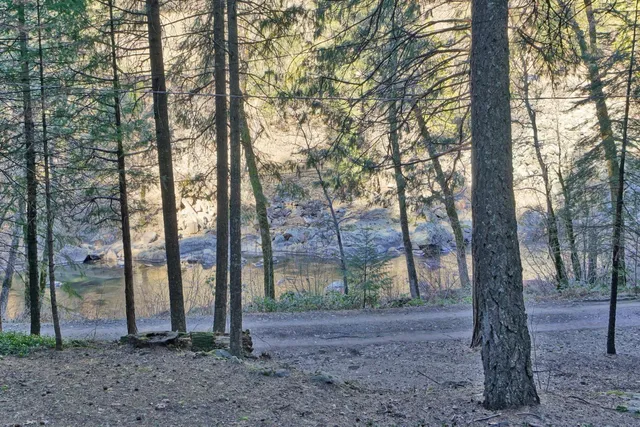 a view of a deck with a table and chairs with wooden floor and fence