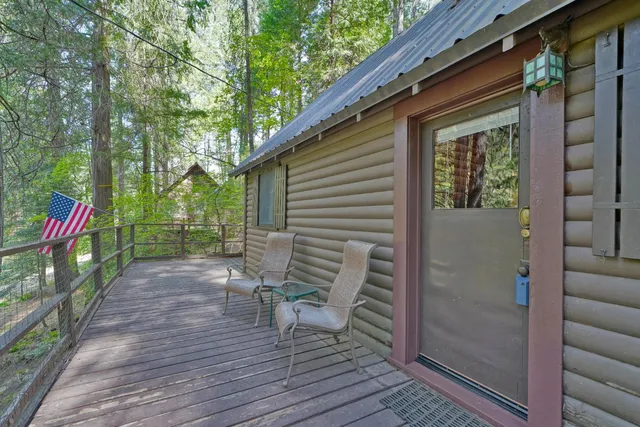 a view of a house with wooden deck