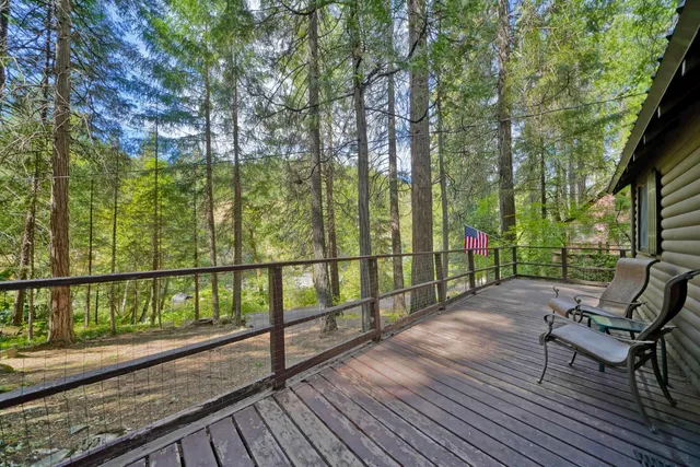 a view of a two chairs on the roof deck