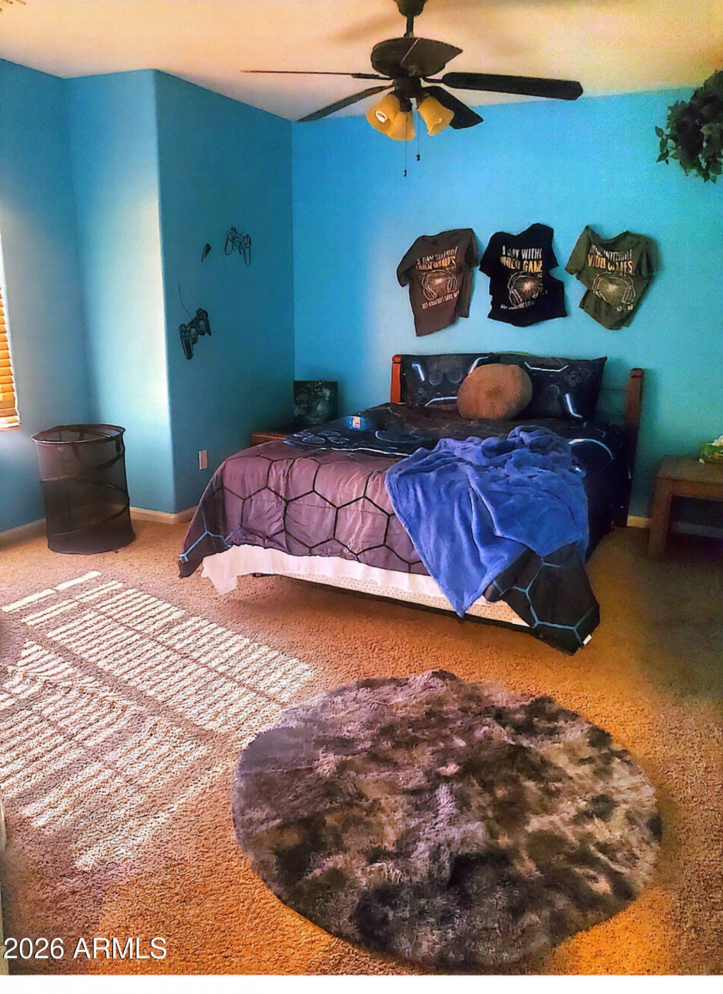 11058 East Cholla Road Mesa, AZ 85207 - Photo 19 of 22 a bedroom with a bed and a painting on the wall