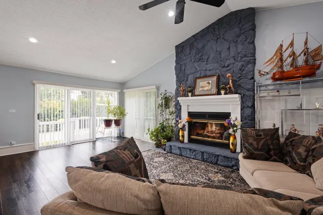 a living room with furniture and a fireplace