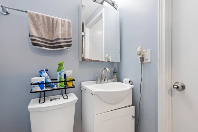 a bathroom with a sink a washer and dryer