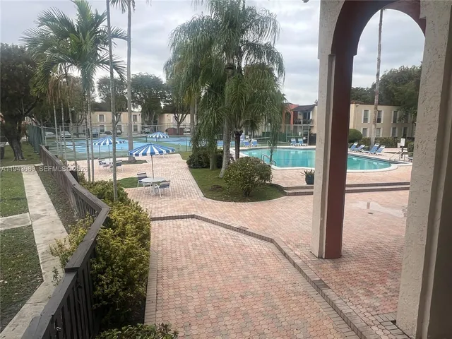 a view of a swimming pool with a patio