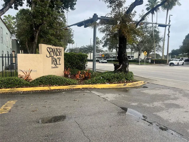 a view of a street with houses on both side