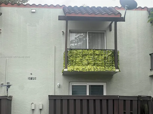 a view of a house with a street