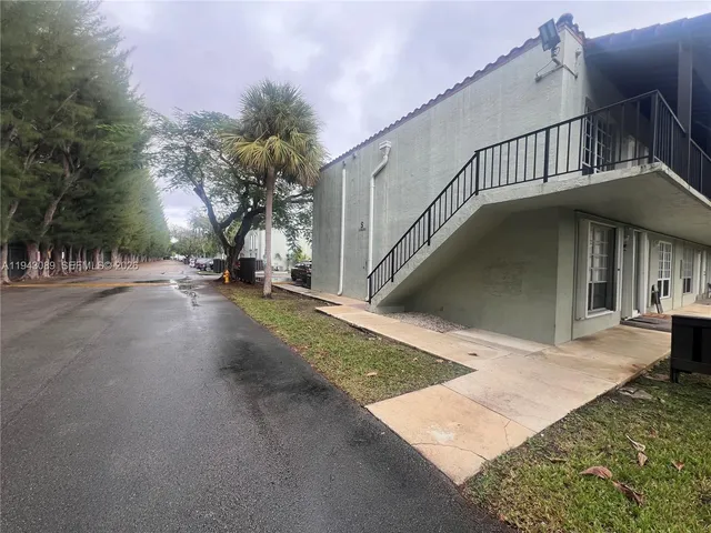 a view of a house with a street