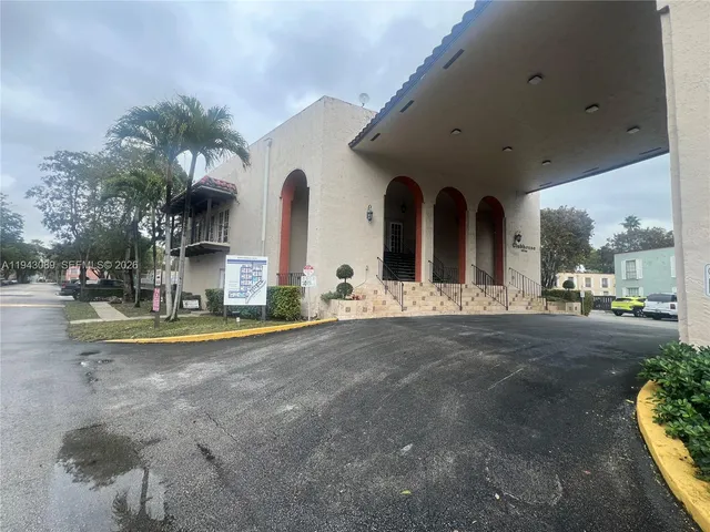 a view of a house with basketball court