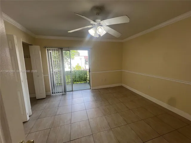 a kitchen with a refrigerator and a sink