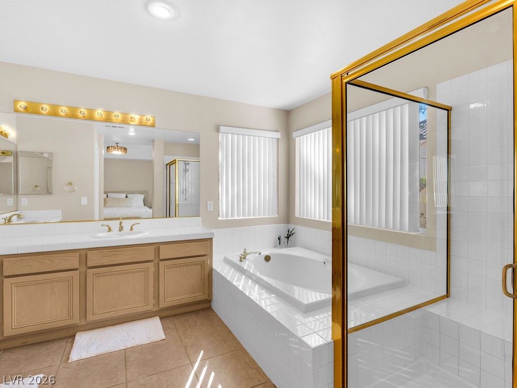 9201 Eagle Ridge Drive Las Vegas, NV 89134 - Photo 8 of 35 Primary bathroom with separate shower stall and bathtub.