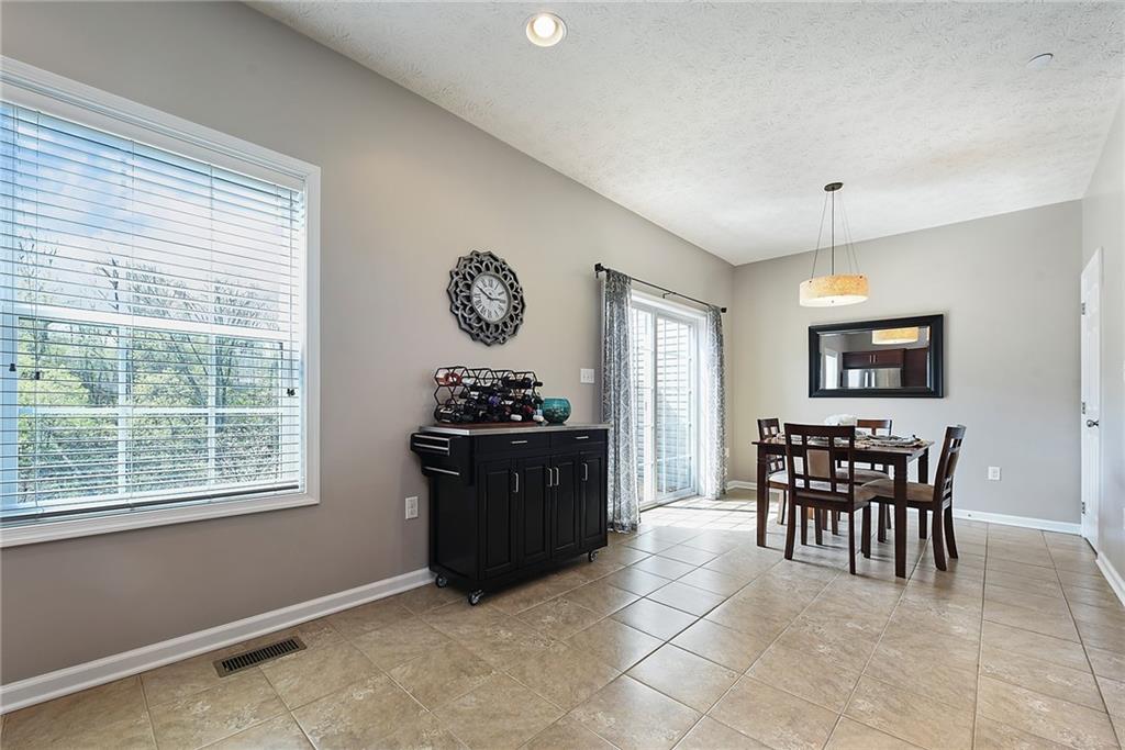 703 Freedom Drive Pittsburgh, PA 15205 - Photo 17 of 42 a kitchen with a refrigerator and a table chair