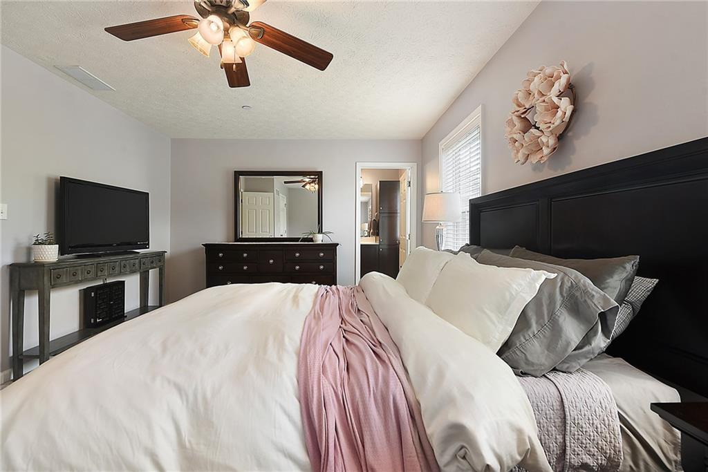 703 Freedom Drive Pittsburgh, PA 15205 - Photo 24 of 42 a bedroom with a bed and a flat screen tv