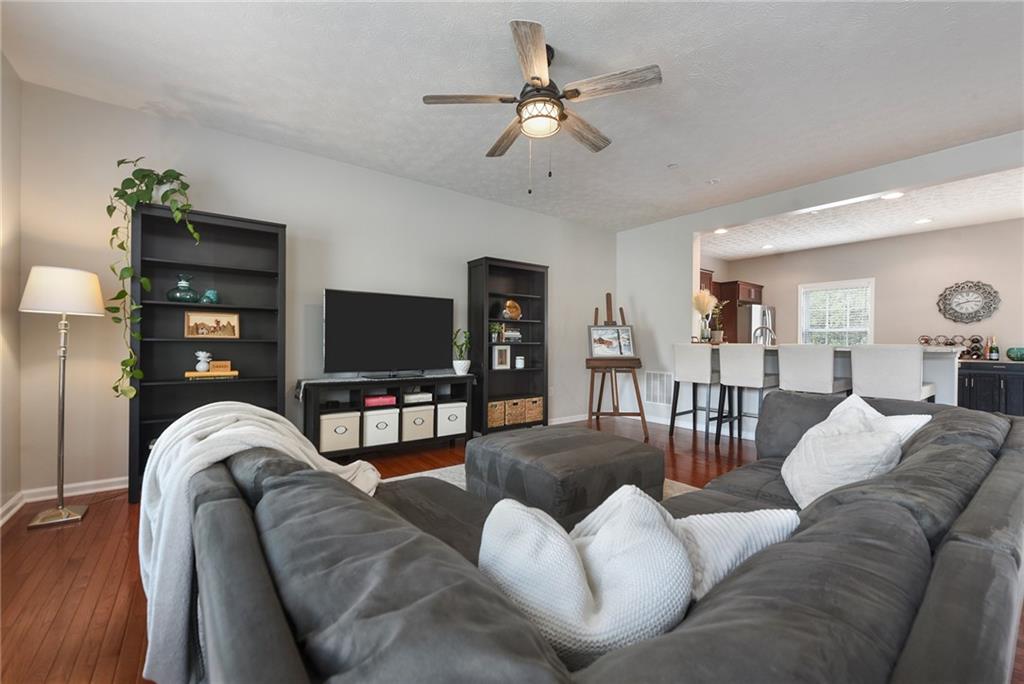 703 Freedom Drive Pittsburgh, PA 15205 - Photo 5 of 42 a living room with furniture a ceiling fan and a flat screen tv