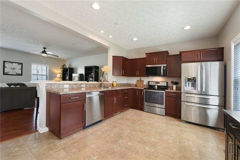 703 Freedom Drive Pittsburgh, PA 15205 - Photo 9 of 42 a kitchen with stainless steel appliances granite countertop a refrigerator stove and sink