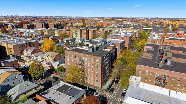 an aerial view of a city with parking