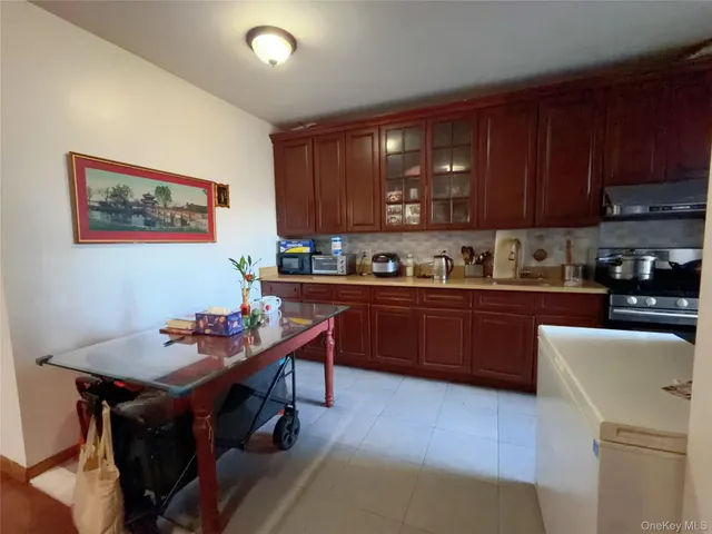 a kitchen with a cabinets and appliances