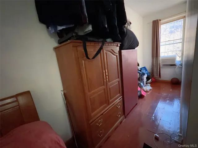 a view of hallway with wooden floor