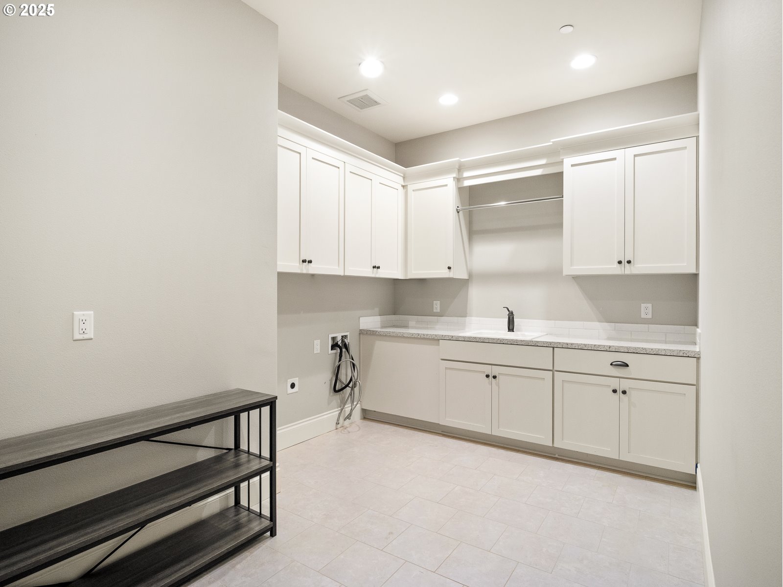 13848 Southeast Diamond Rdg Road Happy Valley, OR 97086 - Photo 41 of 48 a kitchen with white cabinets and sink