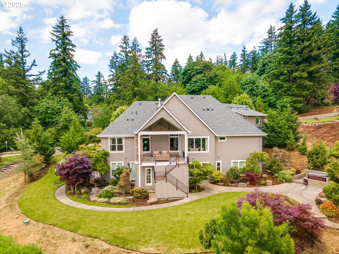 13848 Southeast Diamond Rdg Road Happy Valley, OR 97086 - Photo 46 of 48 a front view of a house with a porch and garden