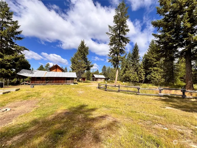 a view of a swimming pool with an outdoor space and seating area